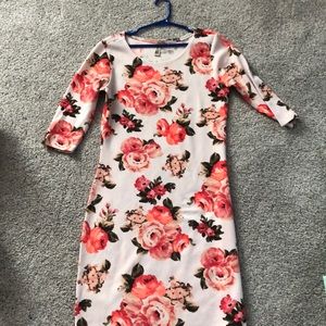 Pink floral dress with quarter length sleeves.